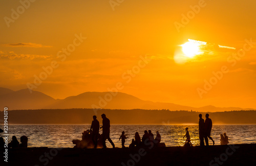 scene view of silhouette people on the beach with sunset,on summer,Seattle,usa.