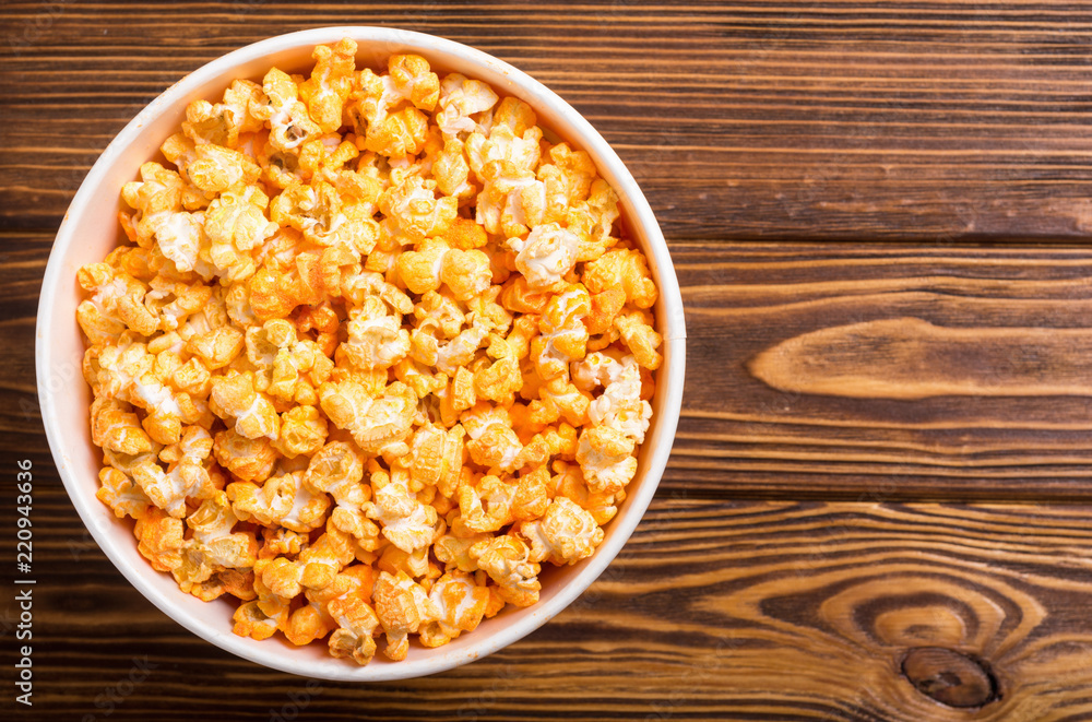 Yellow cheese popcorn in bowl Yellow cheese popcorn in bowl