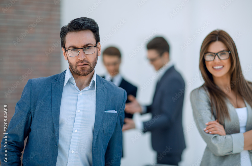 employees of the company standing in a modern office employees of the company standing in a modern office
