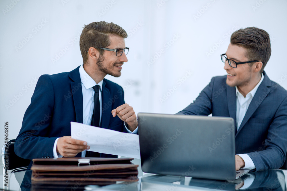 close up.two business men discussing a business document close up.two business men discussing a business document