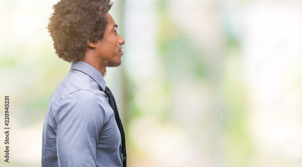 Afro american business man over isolated background looking to side, relax profile pose with natural face with confident smile. Afro american business man over isolated background looking to side, relax profile pose with natural face with confident smile.