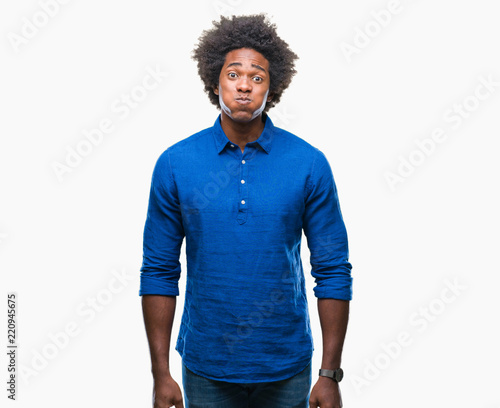 Afro american man over isolated background puffing cheeks with funny face. Mouth inflated with air, crazy expression.