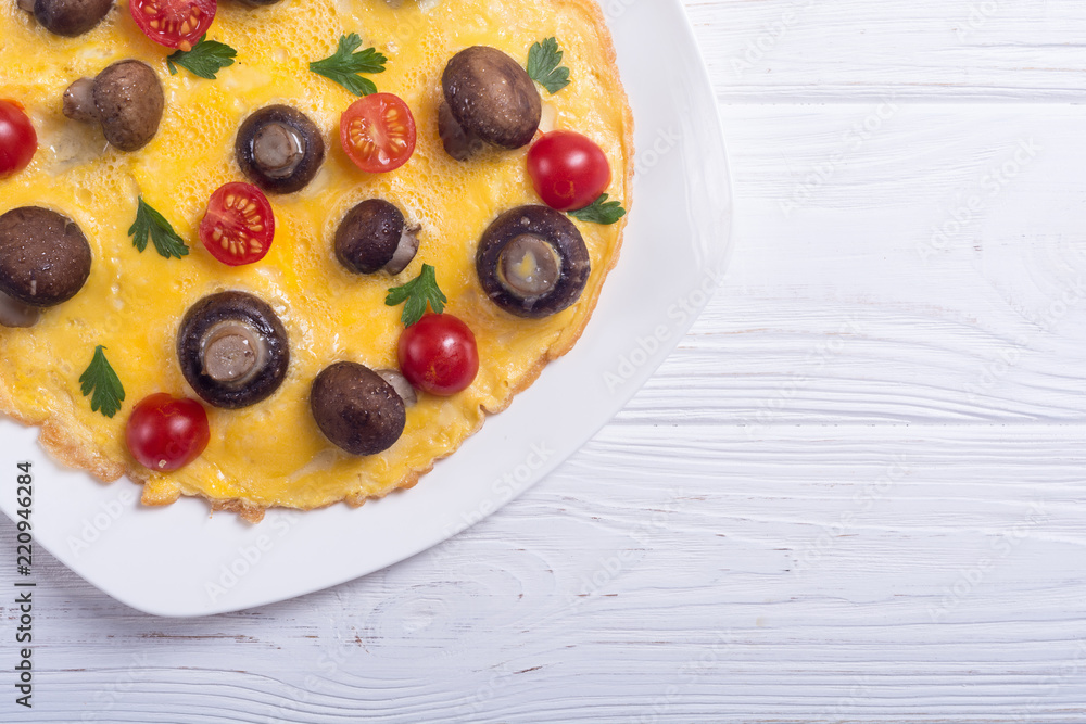 Omelette with mushroom , tomato and parsley Omelette with mushroom , tomato and parsley
