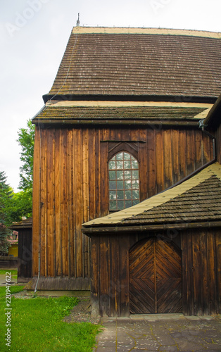 The historic St Bartholomew's Parish Church in Nowa Huta, Krakow. This wooden gothic church has a three nave body and dates from 1466
 photo