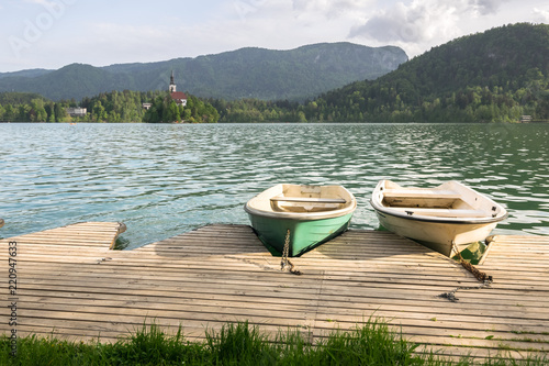 Fototapeta Naklejka Na Ścianę i Meble -  Traditional wooden boats Pletna on Lake Bled, Triglav National Park, Upper Carniolan, Slovenia, Europe