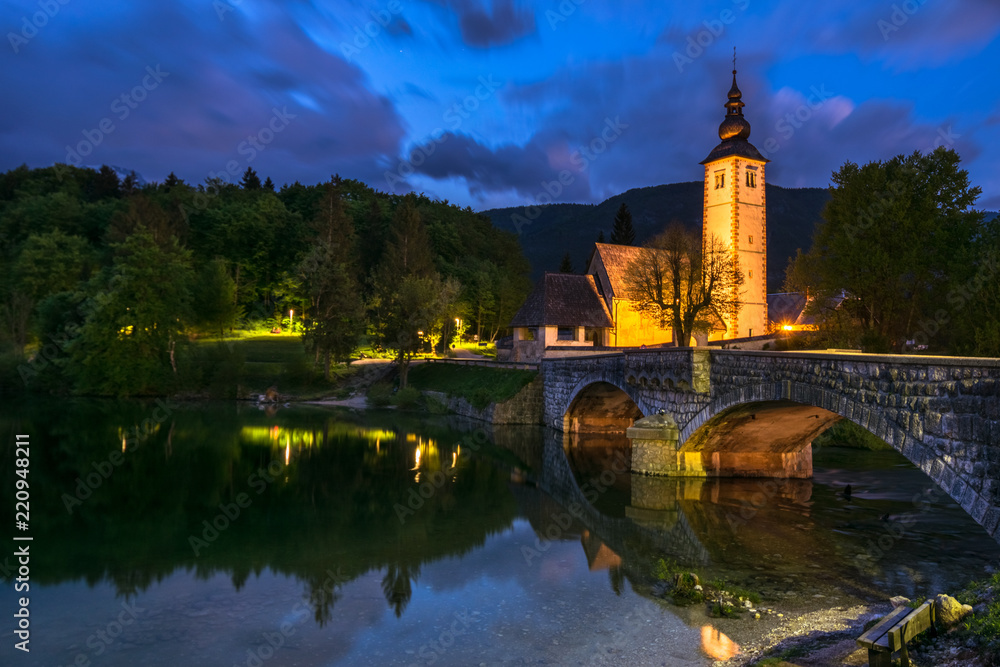 Church of St John the Baptist with bridge at sunset, Bohinj Valley and Lake, Triglav National Park, Upper Carniolan, Slovenia, Europe