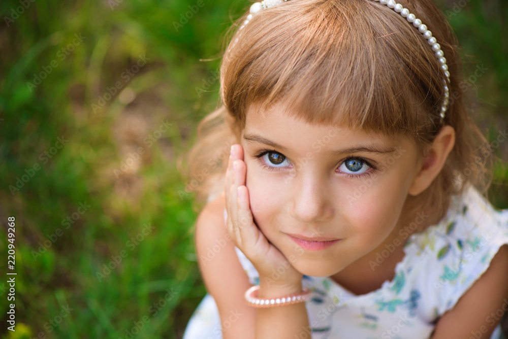Llittle girl child outdoor in summer day. Llittle girl child outdoor in summer day.