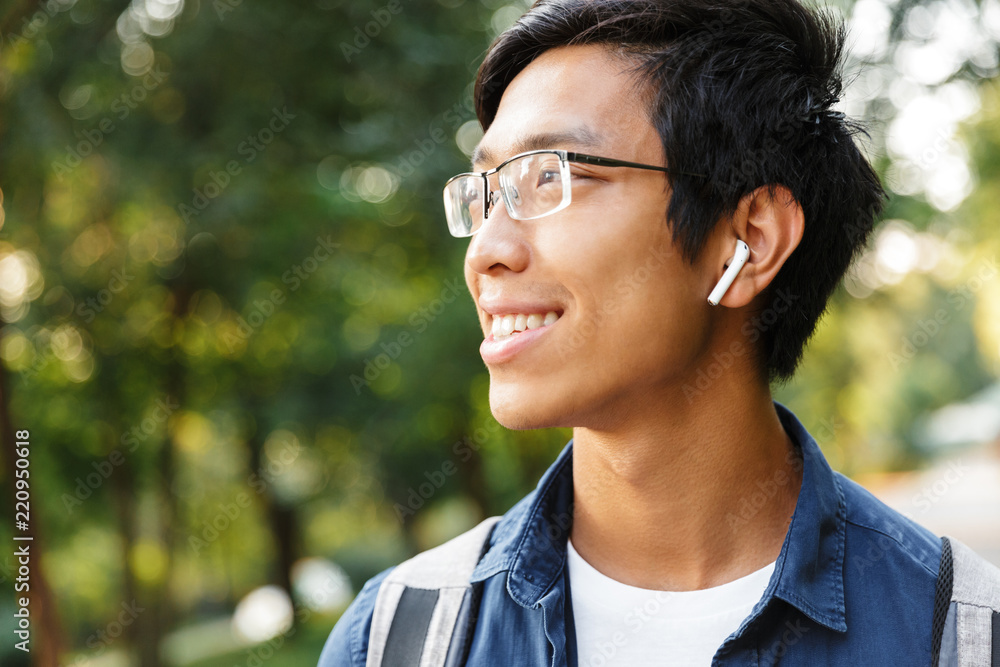 Close up image of Smiling asian male student in eyeglasses Close up image of Smiling asian male student in eyeglasses