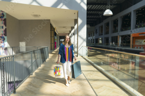 sale concept. woman with a shopping bags. Beautiful woman at the shopping center with bags.