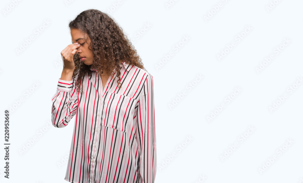 Beautiful young hispanic woman tired rubbing nose and eyes feeling fatigue and headache. Stress and frustration concept. Beautiful young hispanic woman tired rubbing nose and eyes feeling fatigue and headache. Stress and frustration concept.