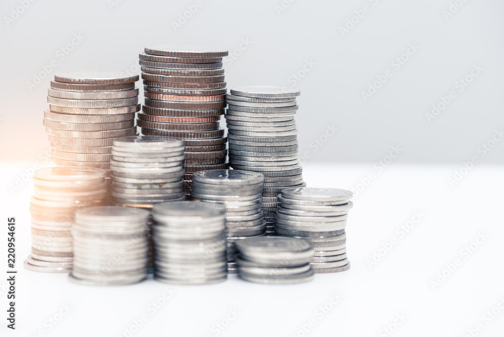 the abstract image of the coin stack and sunlight. the concept of accounting, business, financial, economy and investment. the abstract image of the coin stack and sunlight. the concept of accounting, business, financial, economy and investment.