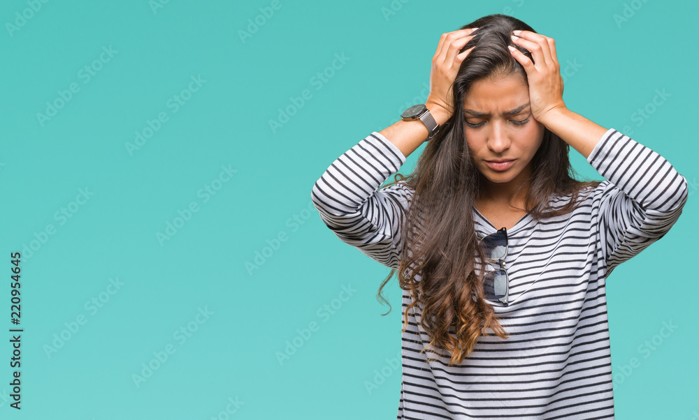 Young beautiful arab woman wearing sunglasses over isolated background suffering from headache desperate and stressed because pain and migraine. Hands on head. Young beautiful arab woman wearing sunglasses over isolated background suffering from headache desperate and stressed because pain and migraine. Hands on head.