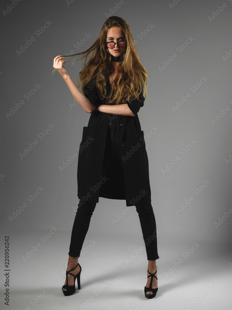 Attractive long hair beautiful woman model standing posing. Attractive long hair beautiful woman model standing posing.