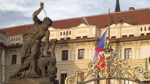 Battling Titans statues at gate to First Courtyard with Hrad or Castle behind in Prague Czech Republic photo