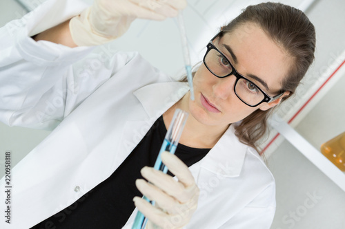 young female tech or scientist performs protein assay