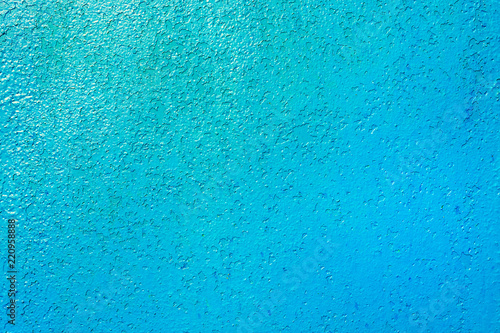 Iron wall painted in blue over the old paint