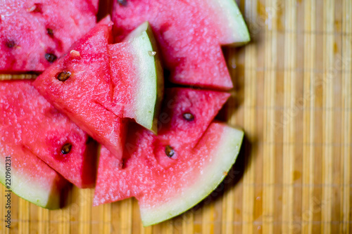 an image of a Fresh sliced red watermelon on a table