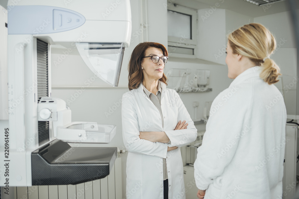 Fototapeta premium Woman Physician Talking With Her Patient