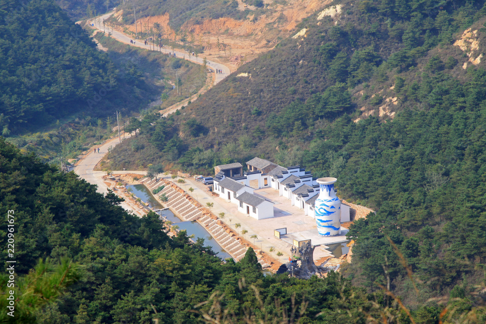 Obraz premium House and other humanities landscape in a scenic area