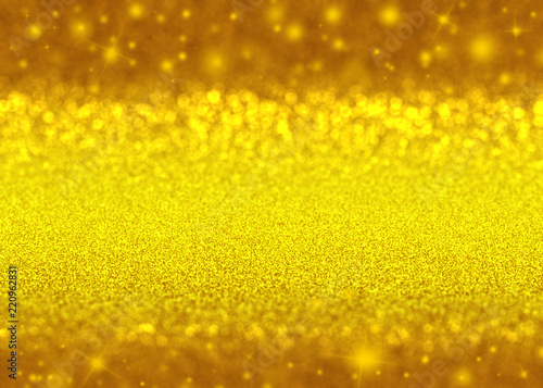 Gold sparkle rays lights with bokeh elegant show on stage abstract background. Dust sparks background.