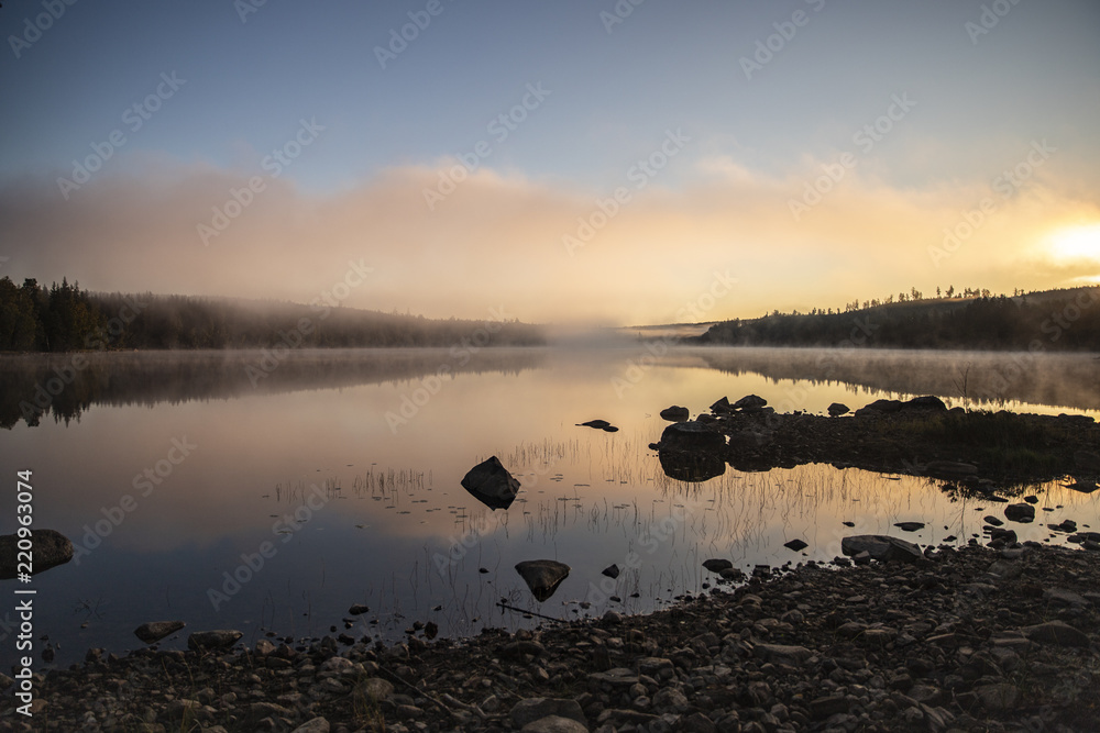 Foggy morning sunrise by the lake Foggy morning sunrise by the lake