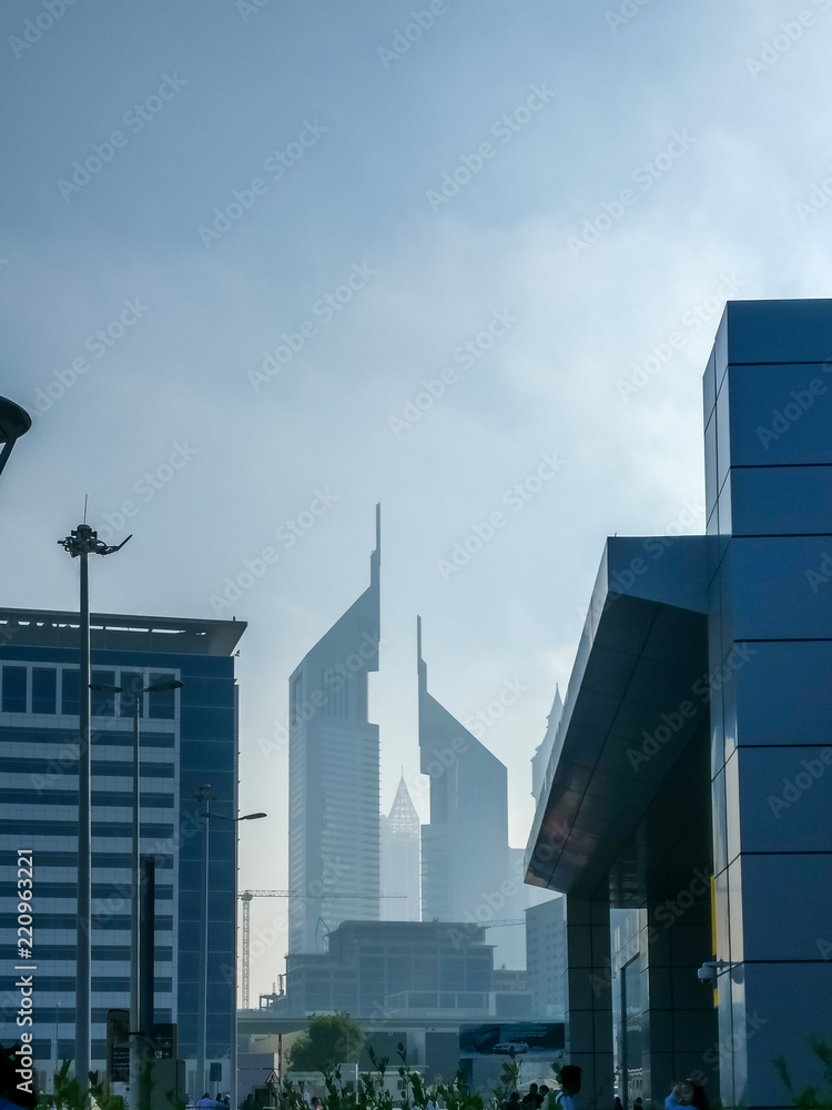 Obraz premium Dubai, UAE - September 29, 2017: an Epic shot of Dubai twin towers on Sheikh Zayed Road from the trade center