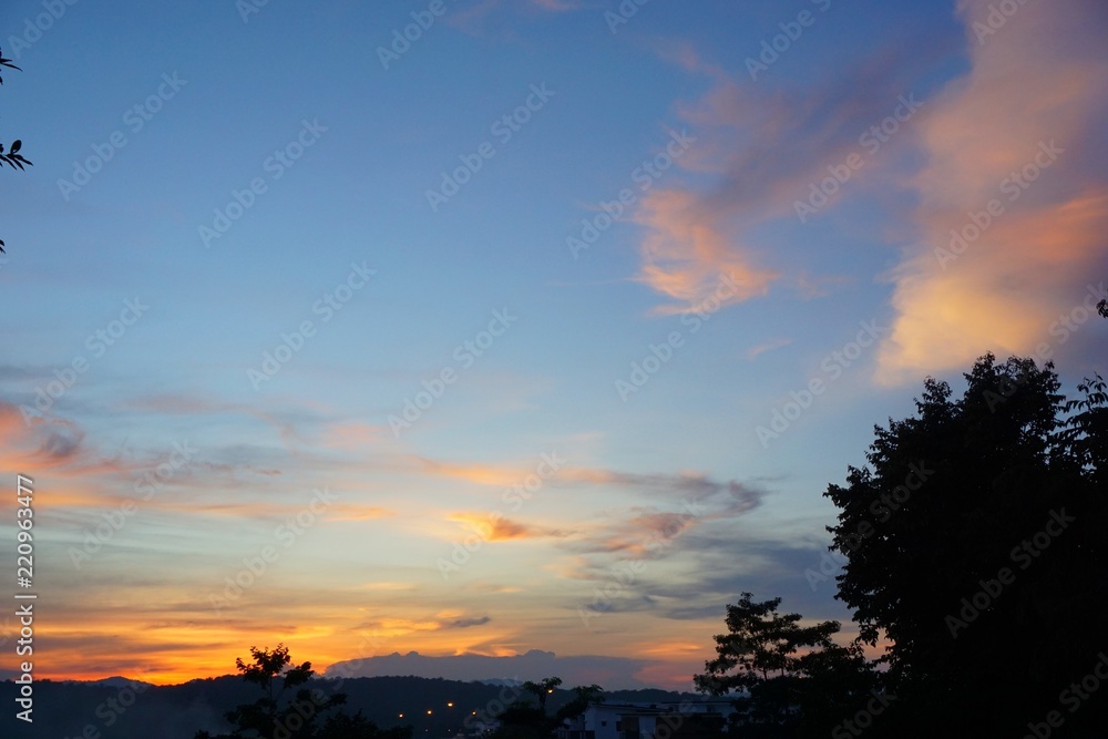 Fototapeta premium Sunset and dramatic sky with trees