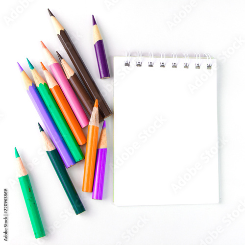 notebook for notes, and pencils on white background