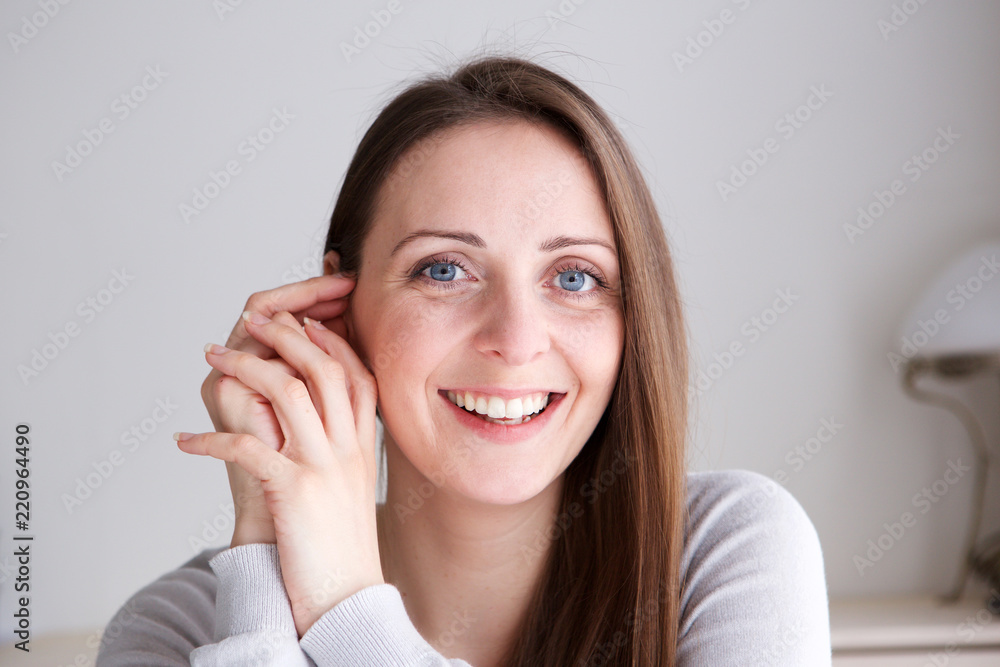 Close up happy young woman smiling and looking at camera Close up happy young woman smiling and looking at camera
