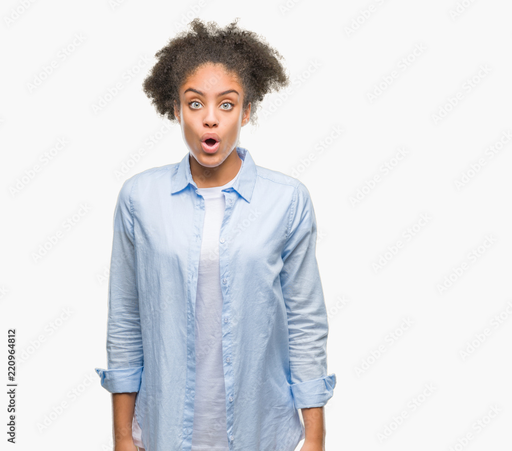 Young afro american woman over isolated background afraid and shocked with surprise expression, fear and excited face. Young afro american woman over isolated background afraid and shocked with surprise expression, fear and excited face.