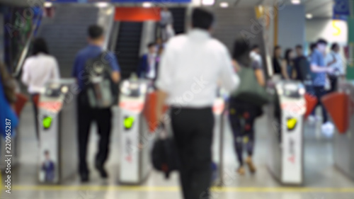 Crowd Going Through Turnstiles Ticket Gates at Train Station - Blurry