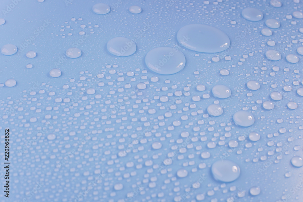 Close up of waterdrop on blue background.