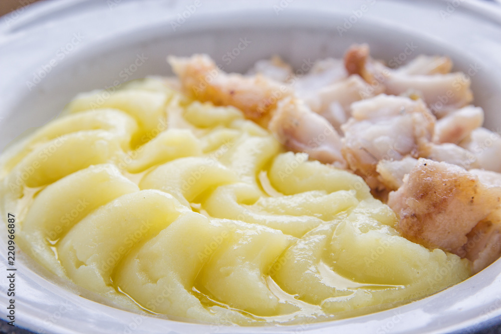Tasty meal with fried fish fillet and mashed potatoes. Tasty meal with fried fish fillet and mashed potatoes.