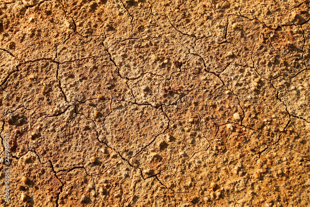 Dry polluted orange stony soil, top view. Dry polluted orange stony soil, top view.