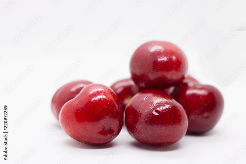 pile of cherries on white pile of cherries on white
