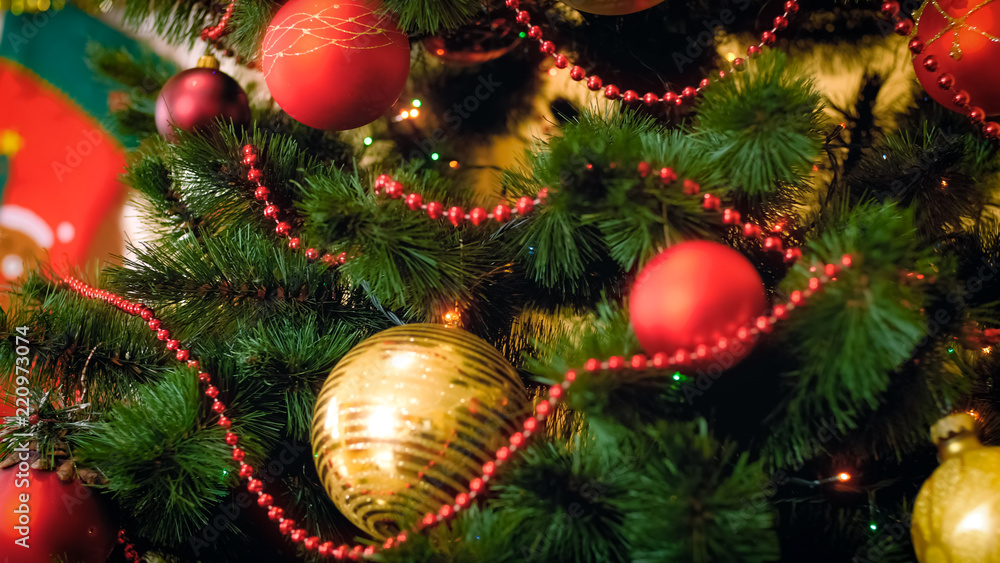 Closeup image of adorned Christmas tree by baubles and beads