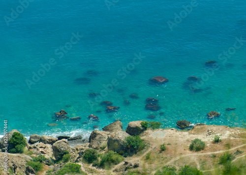 view from the cliffs to the blue sea