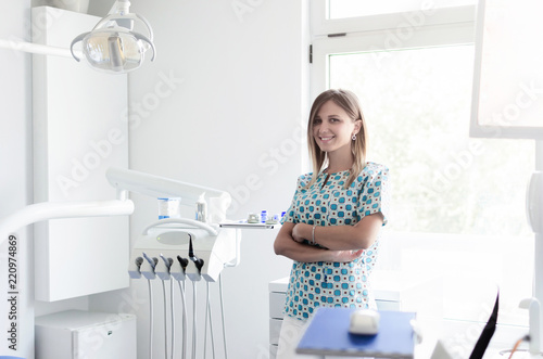 Woman dentist posing in office