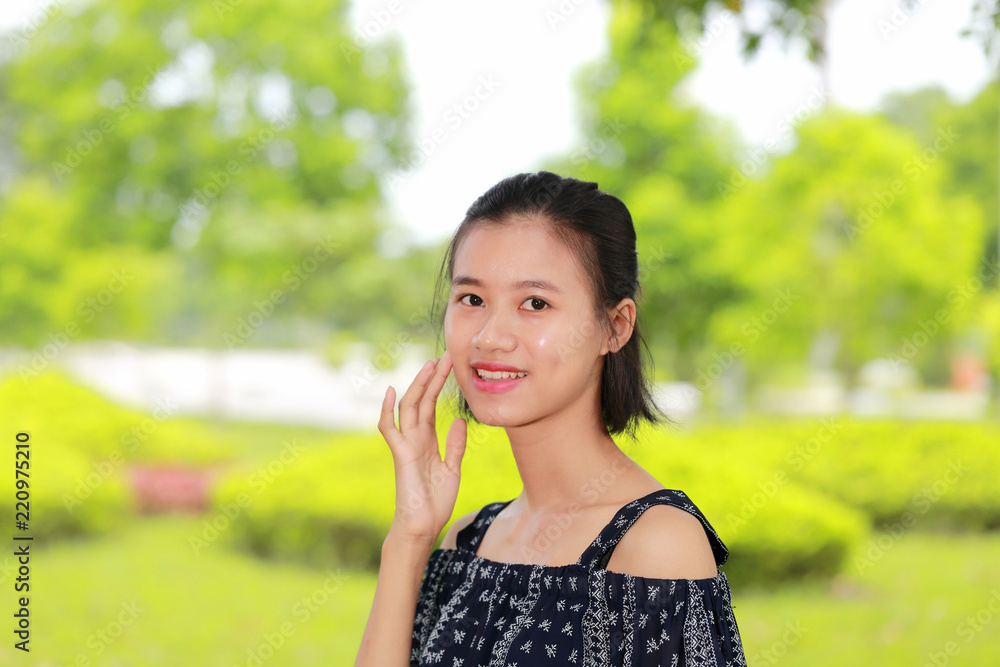 the face of young woman in bright background the face of young woman in bright background