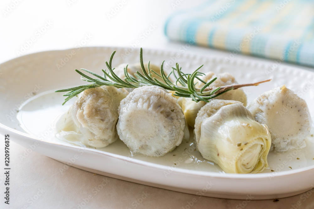 Pickled Artichoke Hearts with Rosemary Marinated in Plate. Pickled Artichoke Hearts with Rosemary Marinated in Plate.