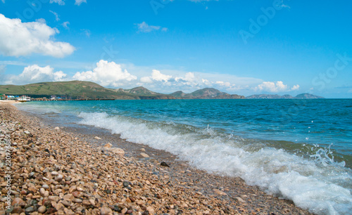 The sea wave is washed by a stony shore
