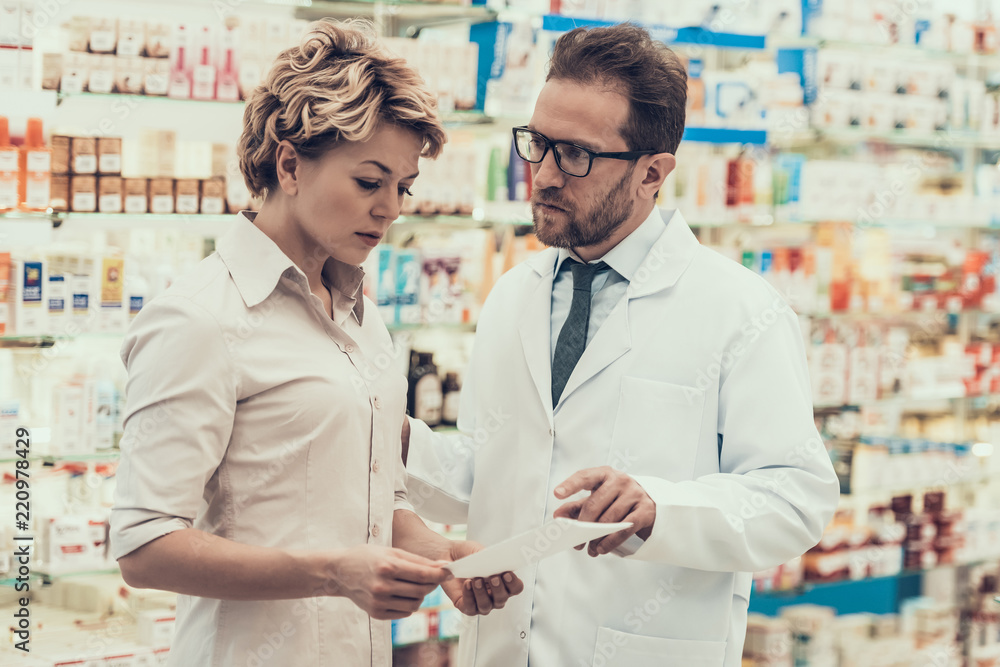 Pharmacist counseling Female Customer in Drugstore Pharmacist counseling Female Customer in Drugstore