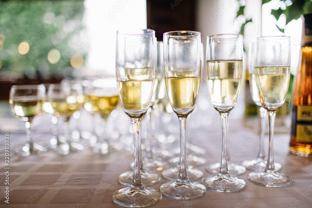 Festive table setting with champagne. champagne glasses close up Festive table setting with champagne. champagne glasses close up