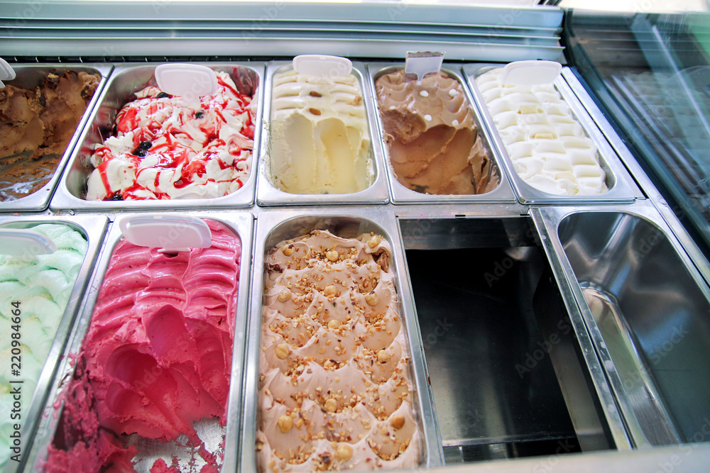 Ice cream fridge with creamy and fruit Italian ice cream steel serving