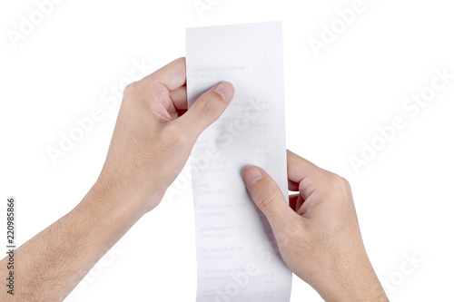 Photography Man hand holding checking a bill receipt grocery shopping list of supermarket is
