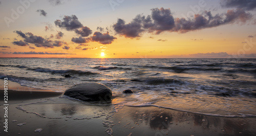 Romantic sunset over the sea beach, baltic sea, Poland