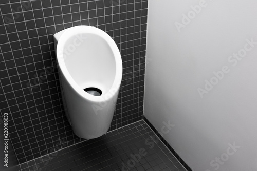 Design urinal for men, New modern European black toilet for men, Elegant men's toilet with ceramic urinal and gray washable surface