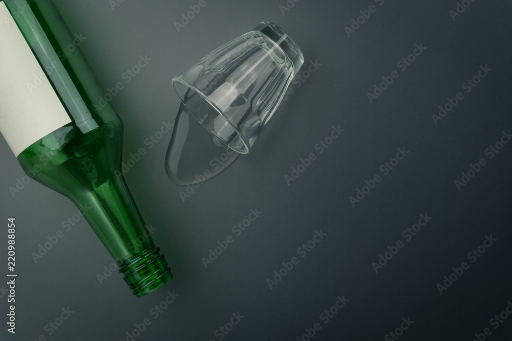 top view of soju bottle with glass of soju spilled on the table. Soju