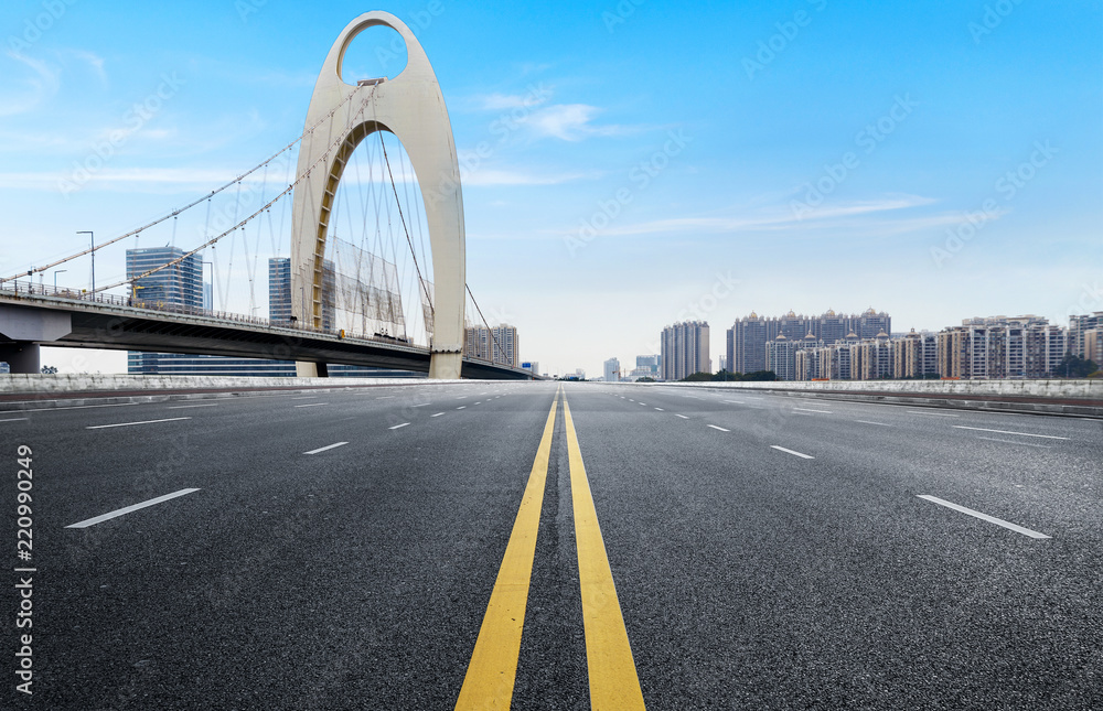 Naklejka premium Empty road floor surface with modern city landmark buildings of guangzhou bund Skyline