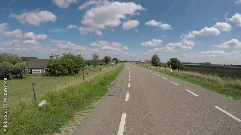 POV driving on polder dike near river Rhine in Holland between Amerongen and Wijk bij Duurstede backwards view POV driving on polder dike near river Rhine in Holland between Amerongen and Wijk bij Duurstede backwards view